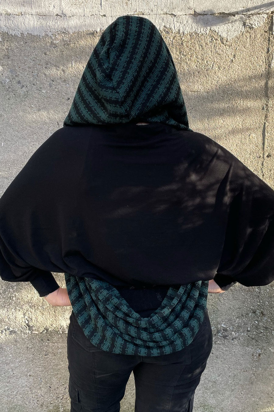 back of woman wearing Snuggle Weather Hunter Green & Black Hooded Infinity Scarf AKA the Empire
